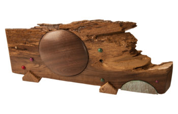 Salvaged Walnut slab with turned walnut disc. This unique piece would be a great decorative addition to your home or office.