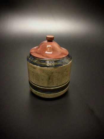 mid fired ceramic jar with a lid turned from salvaged Sea Grape.