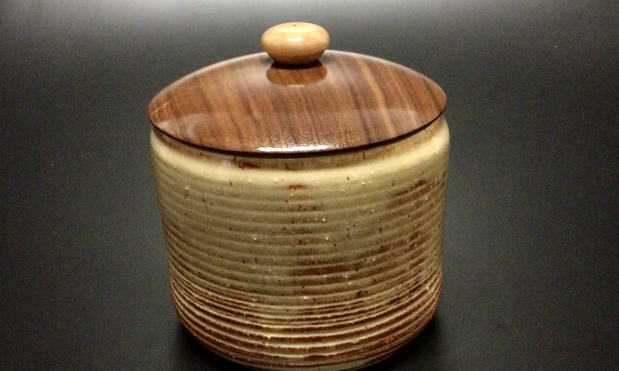 glazed mid fired ceramic jar with a turned walnut lid and a turned maple knob