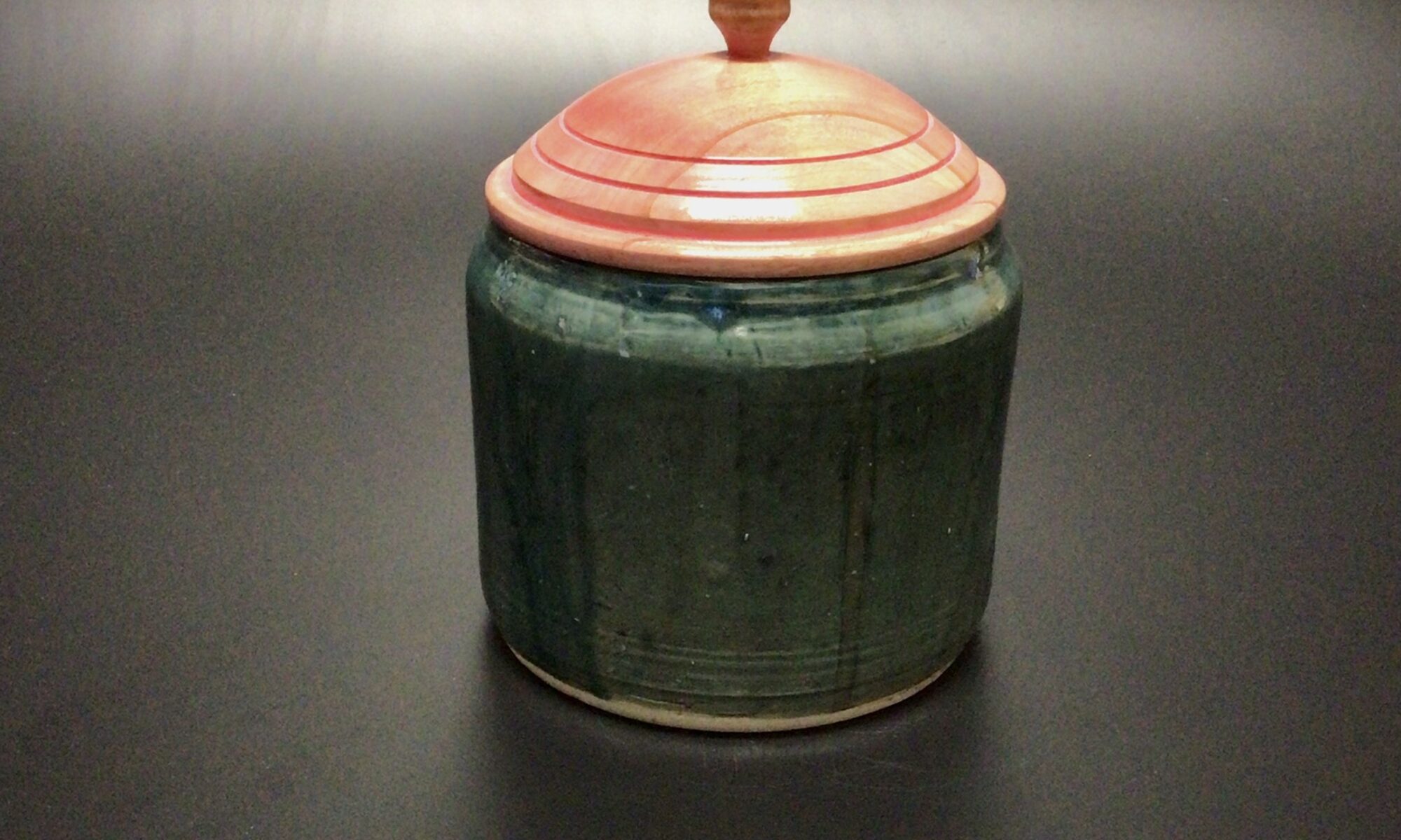 glazed mid fired ceramic jar with an acrylic latex tinted , turned maple lid and a turned hickory knob