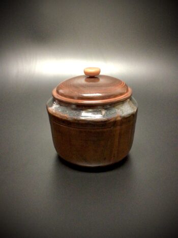 Glazed mid fired ceramic jar with an acrylic latex tinted , turned walnut lid and a turned maple knob