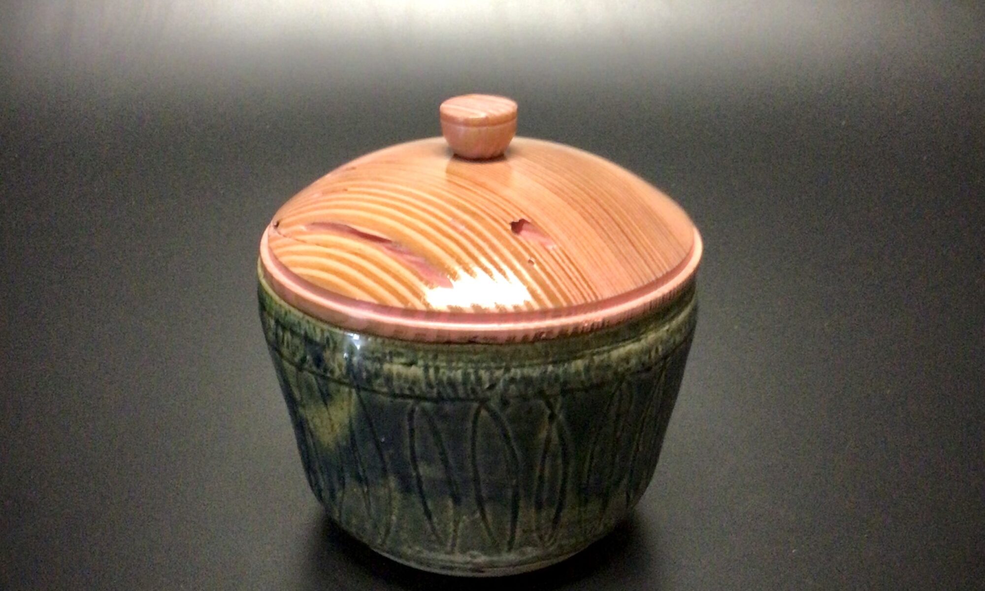 Glazed mid fired ceramic jar with an acrylic latex tinted Florida yellow pine lid and knob.